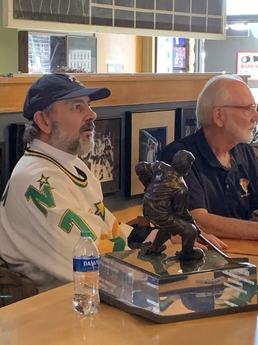 The calm before the Frozen Four Storm: Neal Broten from the University of Minnesota and The Miracle on Ice signing autographs and taking photos with his Hobey Baker Award at Tom Reid’s in Saint Paul.