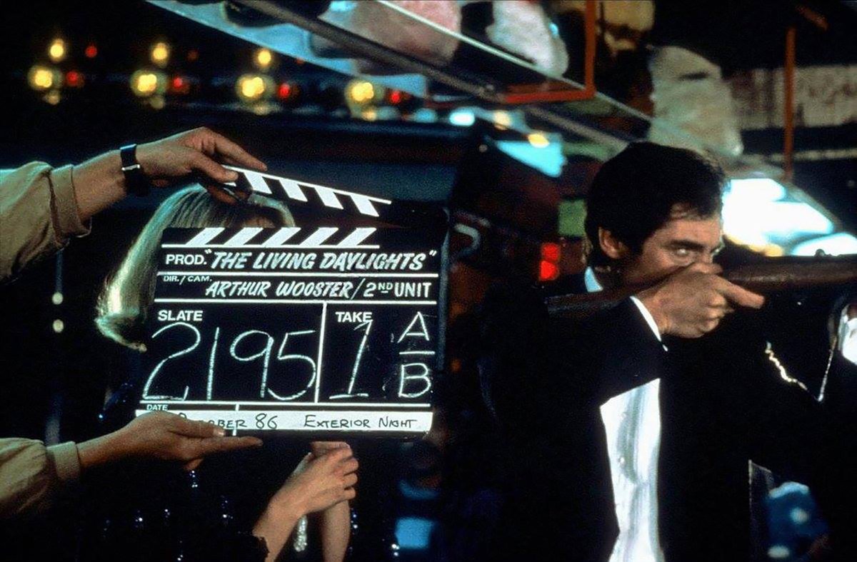 Behind the scenes with Maryam d'Abo and Timothy Dalton on location at the Wurstelprater Amusement Park, Vienna, Austria during filming for The Living Daylights (1987) #JamesBond