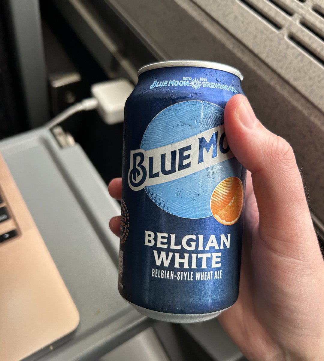 Dudes love drinking a Blue Moon on the train