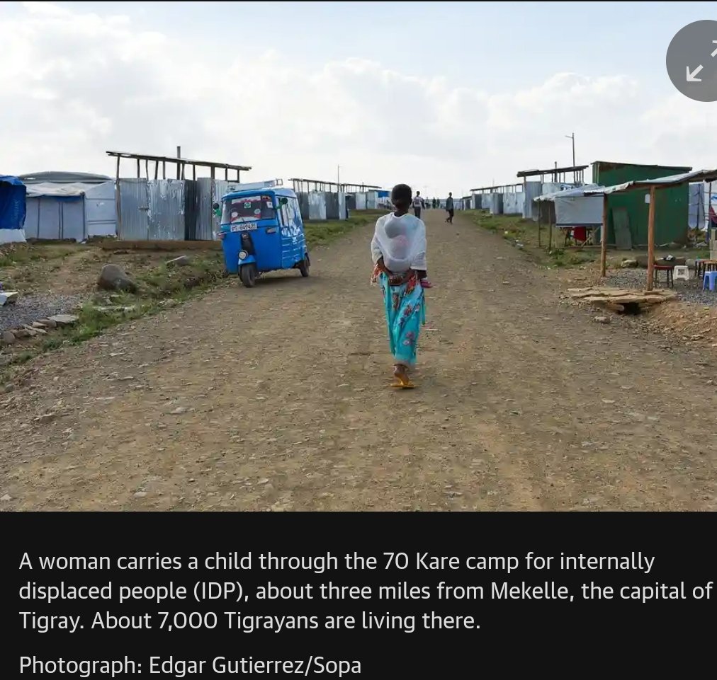 A woman carries a child through the 70 Kare camp for internally displaced people (IDP), about three miles from Mekelle, the capital of Tigray. About 7,000 Tigrayans are living there. Photograph: Edgar Gutierrez #Justice4Tigray #EritreaOutOfTigray @Queenone_16 @Refugees @hrw @UN