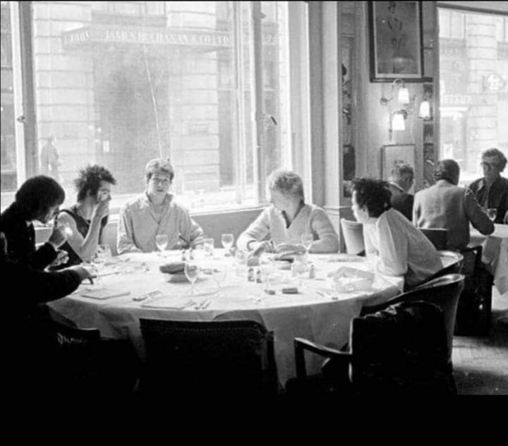 1977, Mayfair, London. The Sex Pistols enjoy a spot of Michelin starred lunch at the exclusive Langan's Brasserie, whose regulars included Princess Margaret, Mick Jagger, Elton John & part owner of the gaff Michael Caine, who is sitting at the next table