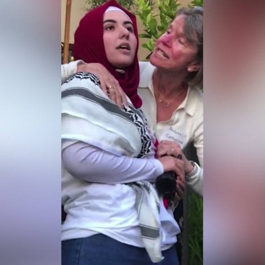 🌙 Eid Mubarak, Muslim Americans 🇺🇸 Time to ward off the blows of your liberal White professors at the most liberal of university campuses, Berkeley! Red-faced Law professor Catherine Fisk grapples a Muslim Law student with both hands while her husband, Berkeley Dean of Law