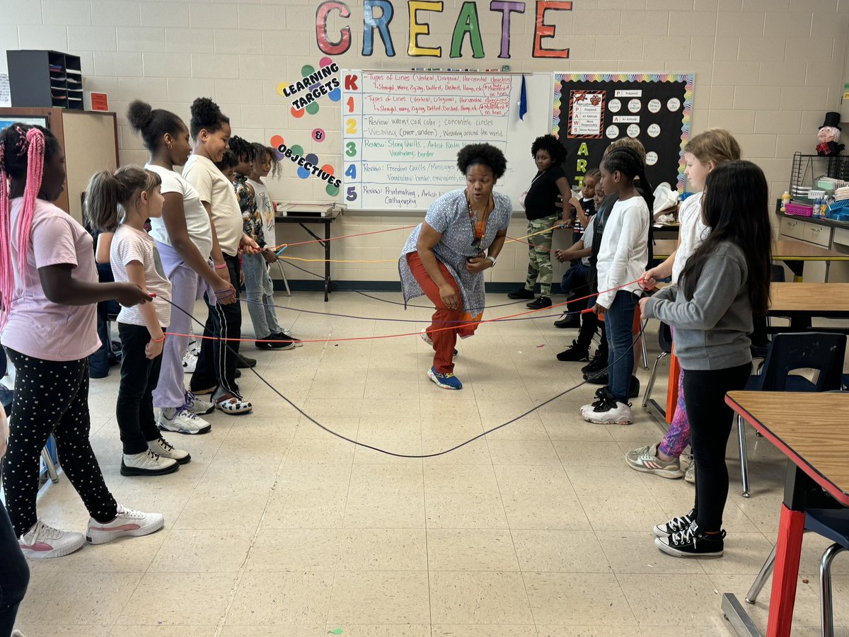 Ms. Sledge used jump ropes and a movement activity to teach 2nd graders about weaving patterns.