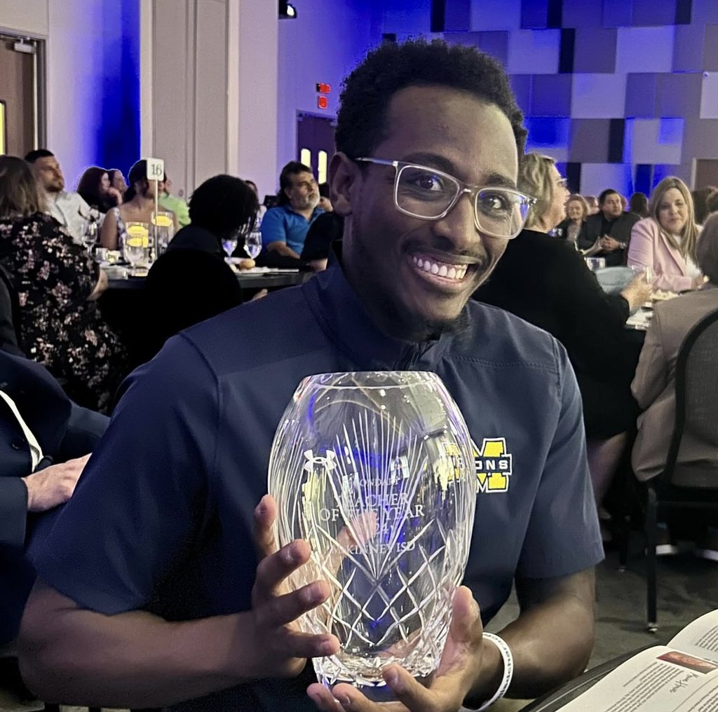 LET’S GO! Our very own Coach Elias Kawesa wins MISD Secondary Teacher of the Year! THE GOLD STANDARD! #GoldStandard🟡🦁