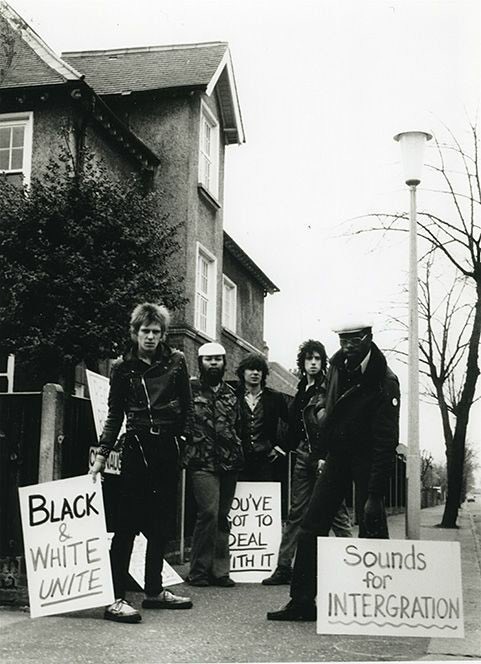 47 years ago Members of Steel Pulse, The Clash, and the Sex Pistols demonstrating outside National Front Leader Martin Webster's house in 1977 l-r Paul Simonon, Ronald McQueen, Glen Matlock, Mick Jones, Basil Gabbidon #TheClash #sexpistols #steelepulse #history #punkrockhistory