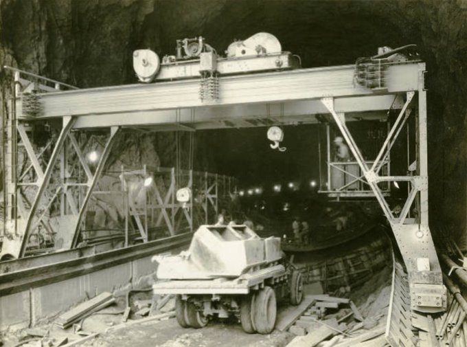UNLV Digital Collections has a couple of photos from construction of diversion tunnels for Hoover Dam taken on Apr 11, 1932. The tunnels were lined with concrete partly to reduce erosion when water was to flow through them. tinyurl.com/adtenu5y