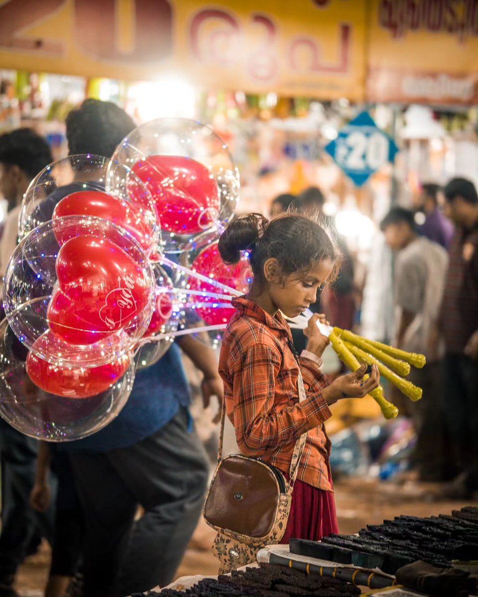 In a world of hardships, a touching scene unfolds: a young girl holds onto balloons, embodying hope and fortitude in the face of adversity. Captured beautifully by Yadunath through Sigma 56mm F1.4 DC DN. #SIGMAPicks #sigmaphotoindia #sigmaindia