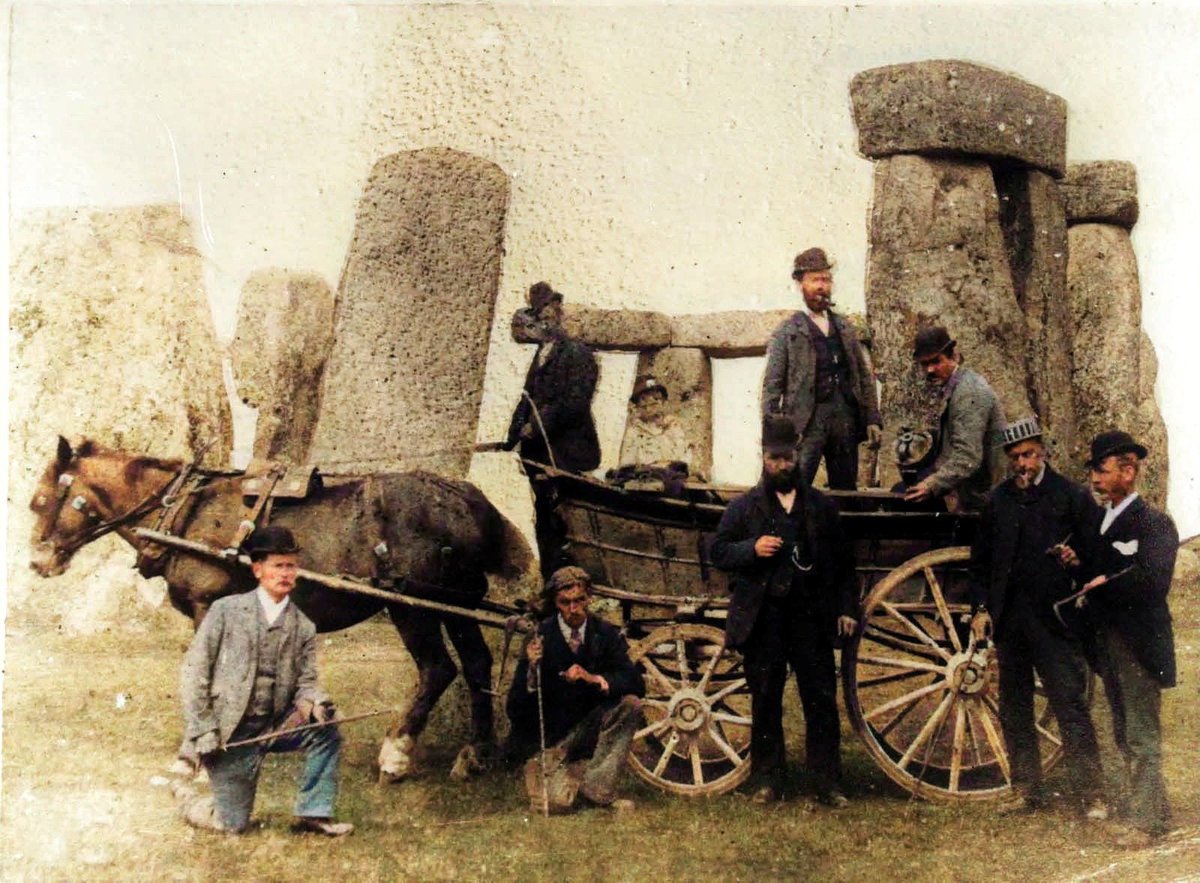 A group of men with a cart in front of Stonehenge. Photo English Heritage. #stonehenge #colourised #englishhistory
