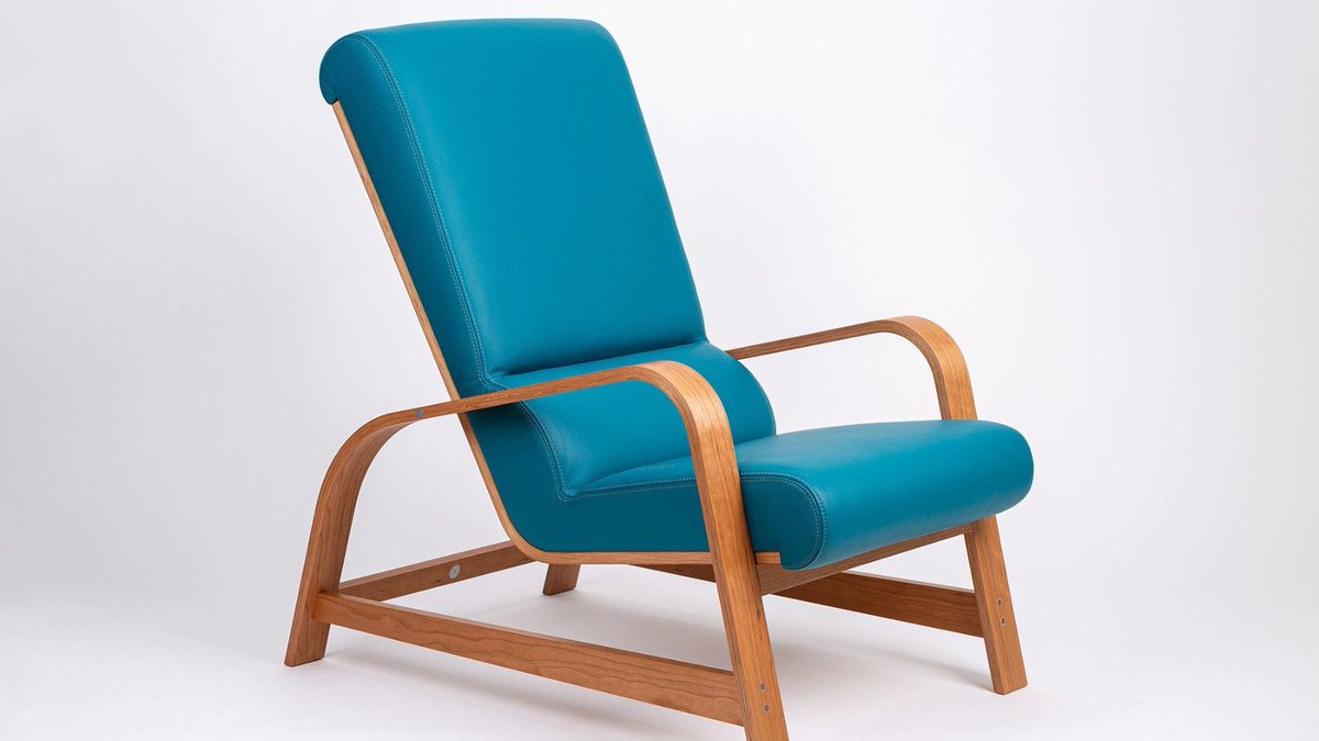 Laid back and stylish, this Art Deco inspired lounge chair would make an elegant addition to any interior. The beautiful teal upholstery brings a real pop of colour whilst the sweeping curves of the American Cherry frame creates a smooth, contemporary feel. Available to view now.