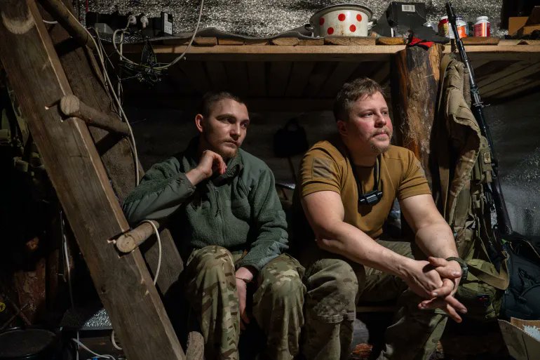 IN PICTURE: Ukrainian servicemen from the Azov brigade rest in the trenches on the front line near Kreminna [Alex Babenko/AP]