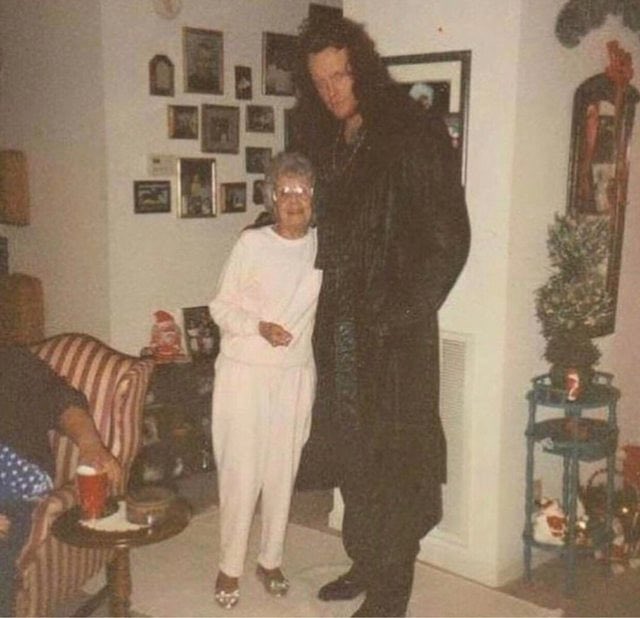 The Undertaker posing with an elderly lady in the 1990s