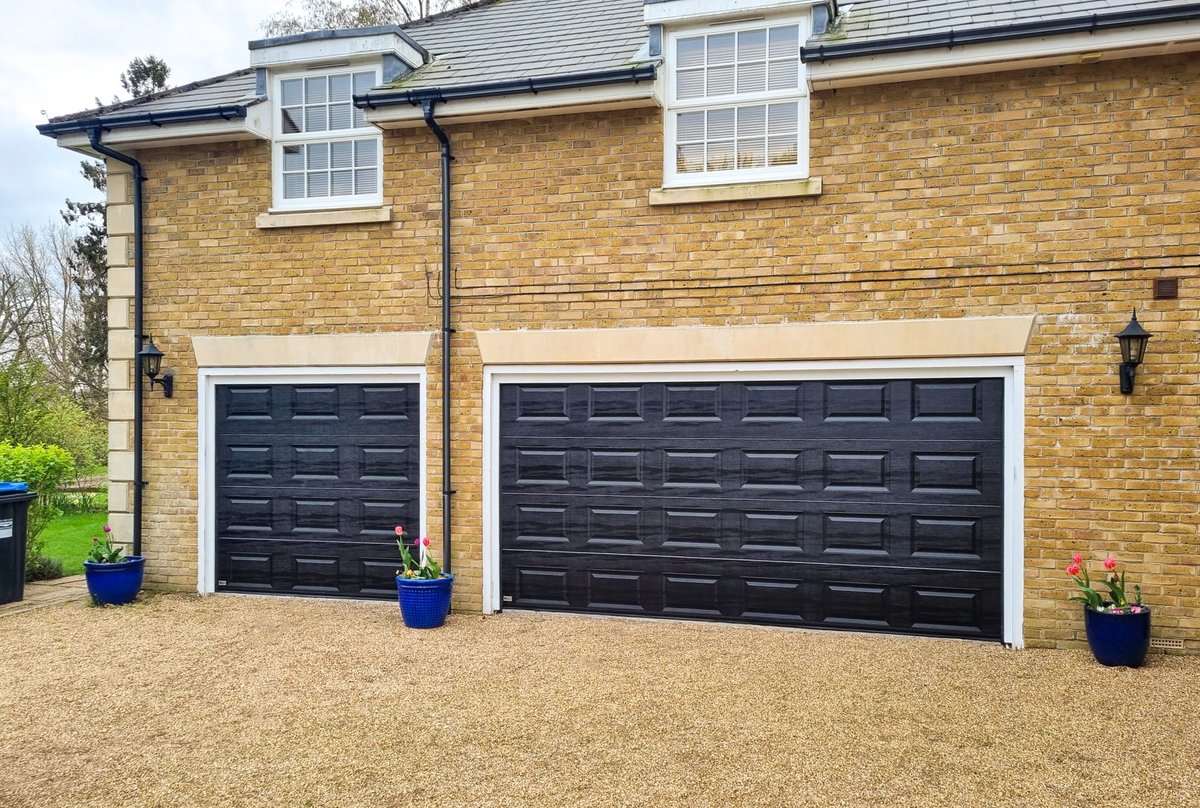 Stunning double installation of the ultra-smooth and ultra-quiet SWS SeceuroGlide Elite sectional garage doors. Finished in black woodgrain with Georgian cassette design. Installed in Warlingham by our Croydon branch. #AccessGD #SeceuroGlide #garagedoors #croydon