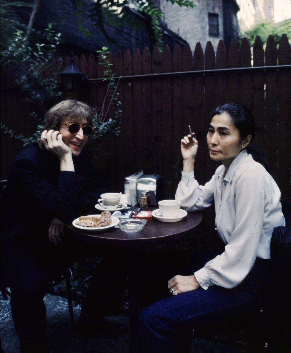 John Lennon and Yoko Ono photographed at Cafe La Fortuna, New York by Kishin Shinoyama, Summer 1980.