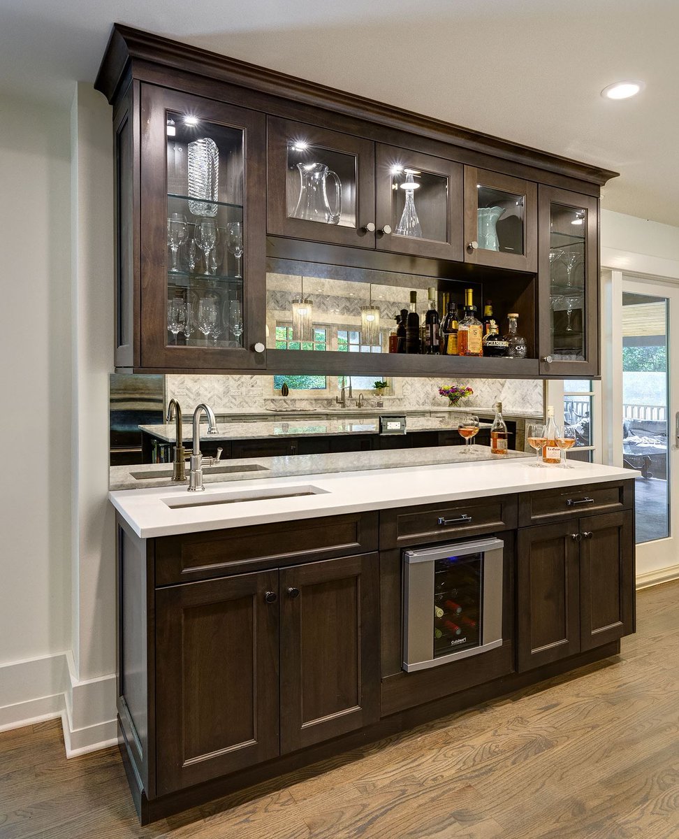 The weekend is finally here! Time to enjoy family and friends. Gather around the island and cook together, grab a drink at the beverage center and relax. #kitchendesign #beveragecenter #customcabinetry

Photo #DennisJourdanPhotography
