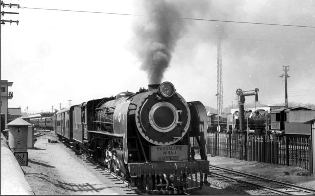 A beautiful photo of YP 2799 Bangalore-Miraj Express screaming out of Bengaluru in the late 1970s! It ran from Bengaluru to Miraj Junction as Kittur Express during the Meter gauge era. It's now called the Rani Chennamma Express which runs from Sangli. @SachinKalbag @somnath1978