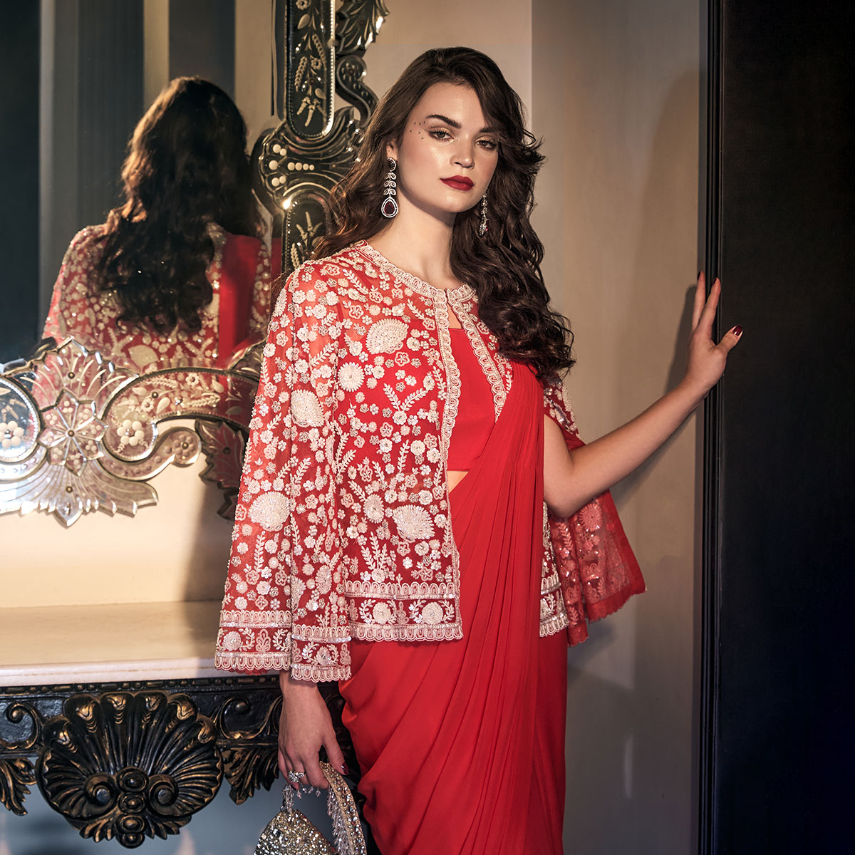 Cherry Chic🌟In vibrant red, an intricately embroidered jacket transform your saree ensemble with #TheJacketStory into a captivating  statement for the wedding festitives✨Shop now and make heads turn with this captivating ensemble💫  #Neerus #TheJacketStory