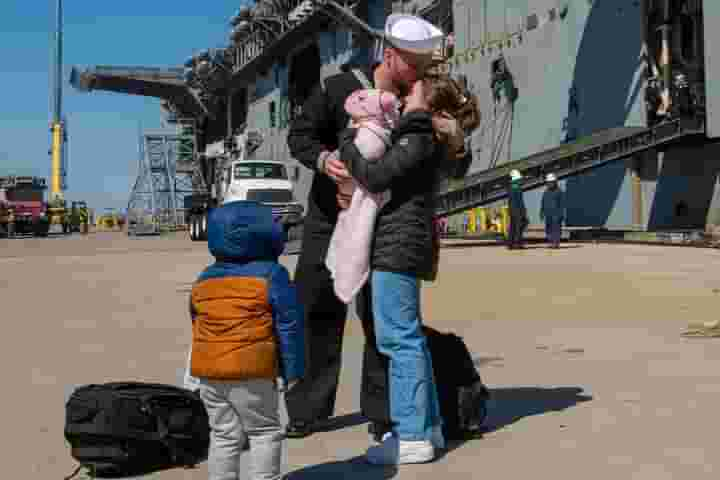 An iconic moment when a ship returns from deployment is the 'first kiss.' A lucky Sailor is the first to get off the ship when returning back home. Check back Thursday to see who disembarks after!