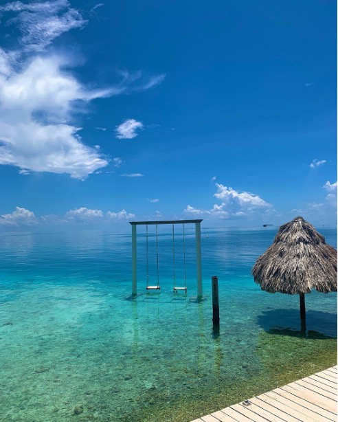 Welcome to paradise, where the turquoise waters of Belize meet the tranquillity of a swing in the sea.🌊🌴   #TravelBelize 📷: @upupnawe