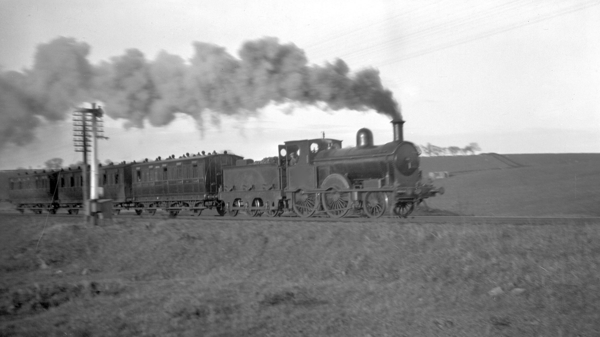 #HappyEaster! 🐰 The Easter Holidays were always a popular time for people to take day trips by train across Northern Ireland. Here we can see the Belfast & County Down Railway 2-4-0 Locomotive No.6 travelling from Comber to Ballynahinch on Easter Tuesday, 1933. #EasterSunday