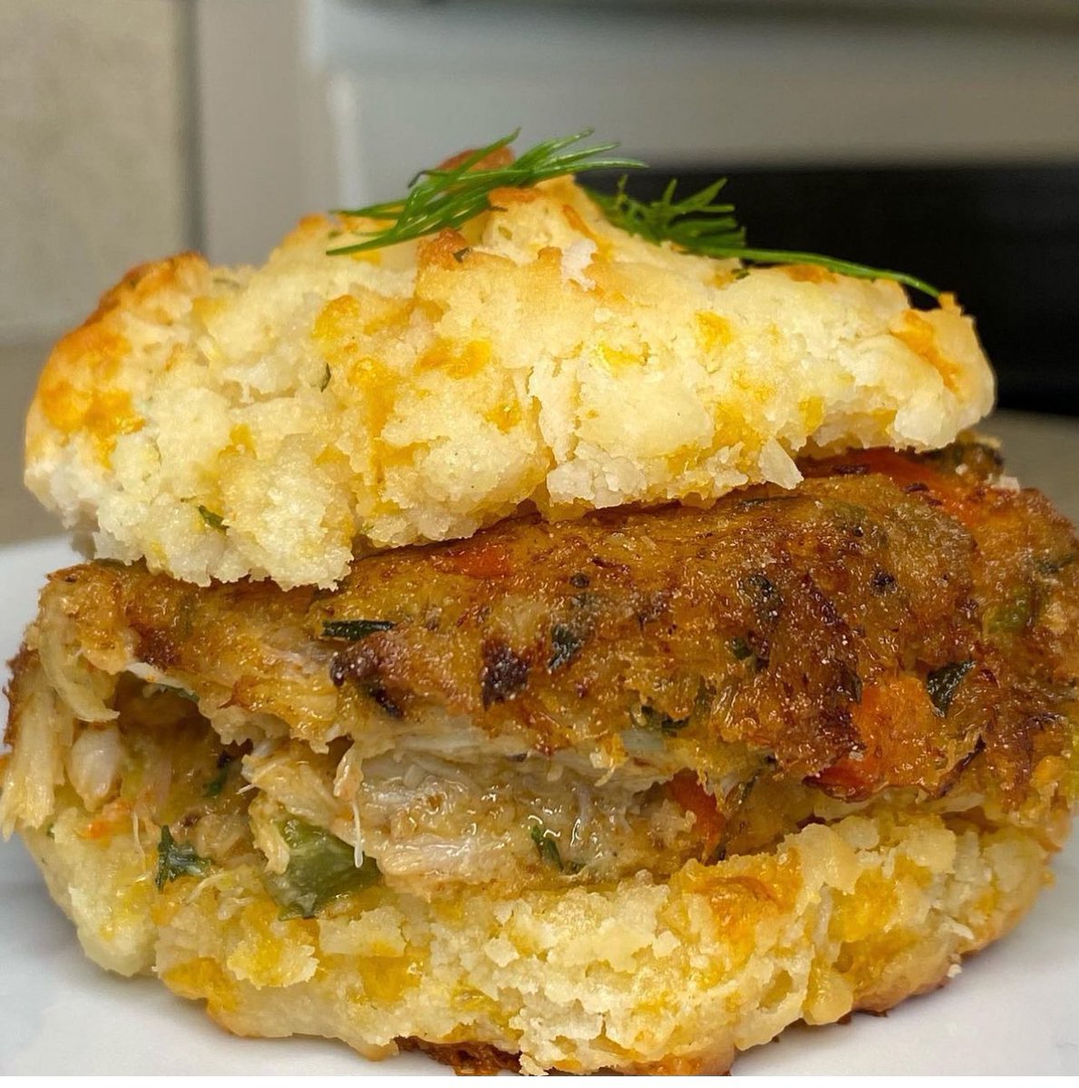Crab cake between a Red Lobster Cheddar Biscuit