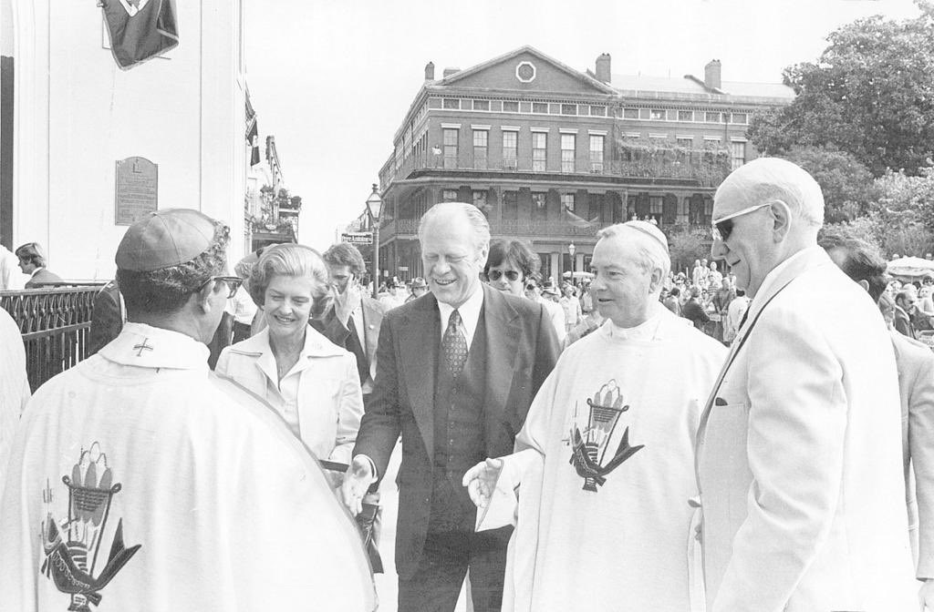 1976 — President Gerald Ford, accompanied by the First Lady, Archbishop of New Orleans Philip M. Hannan, and Congressman F. Edward Hebert, greets Auxiliary Bishop Harold Perry outside St. Louis Cathedral after attending Sunday Mass at the historic church in Jackson Square.