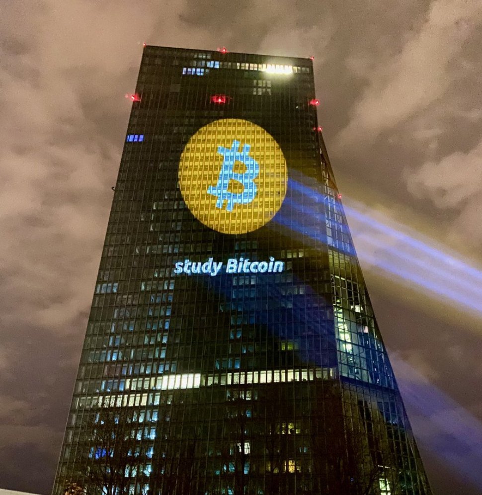 pete_rizzo_'s tweet photo. ✨ 'Study #Bitcoin' projected on the European Central Bank HQ, exactly 1 year ago. Up 160% ever since 💫 https://t.co/biy1YovSKY