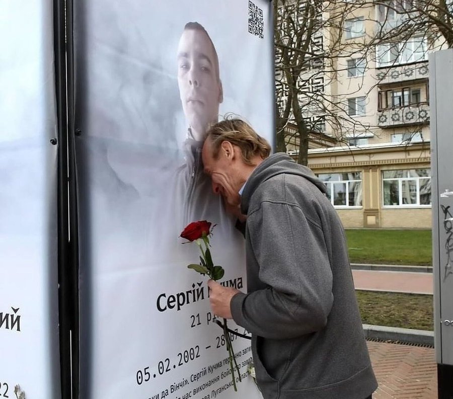 Instead of a thousand words. A father by the portrait of his son who died defending Ukraine. 📷: Volodymyr Tarasov