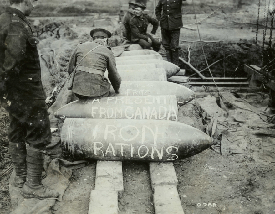 Artillery dominated the First World War battlefield and inflicted the majority of casualties. In this photo, gunners write, 'iron rations' and 'a present from Canada,' on artillery shells before firing them. The word 'rations,' is used here with grim irony. #FirstWorldWar #DYK