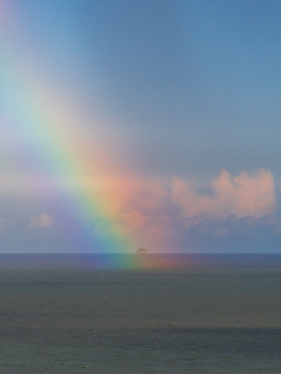 The end of a rainbow over Dublin Bay lined up with Irish Ferries.