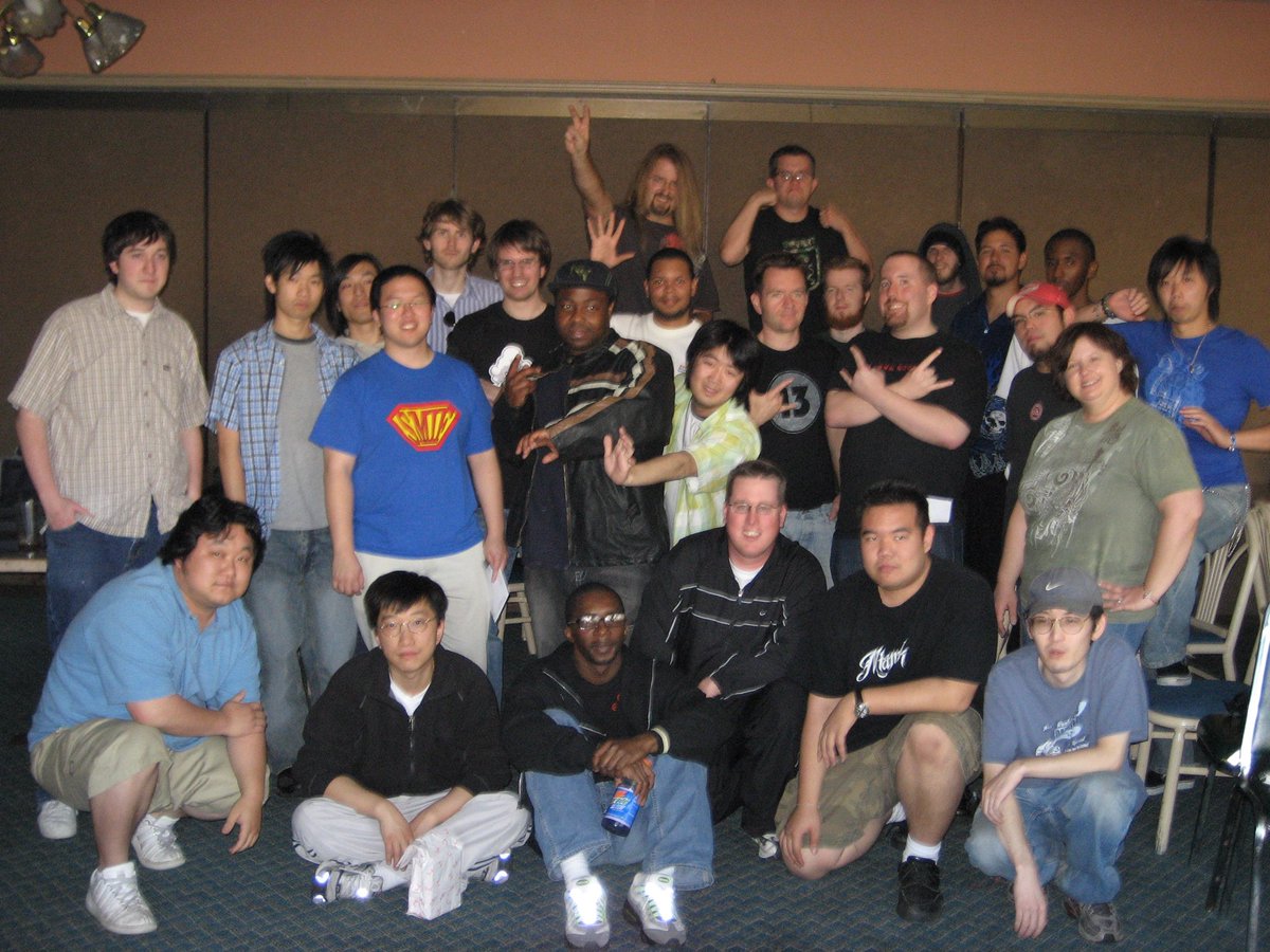 KraftyMattKraft's tweet photo. My buddy @Comtar dug this one out of the archives. Picture taken 17 years ago, today. #VFDC SoCal tournament/gathering at the Sizzler in Jurupa Valley, CA. I'm in the track suit kneeling in the middle. Man, I look young. #FGC #VirtuaFighter https://t.co/qhH3YcZWm1