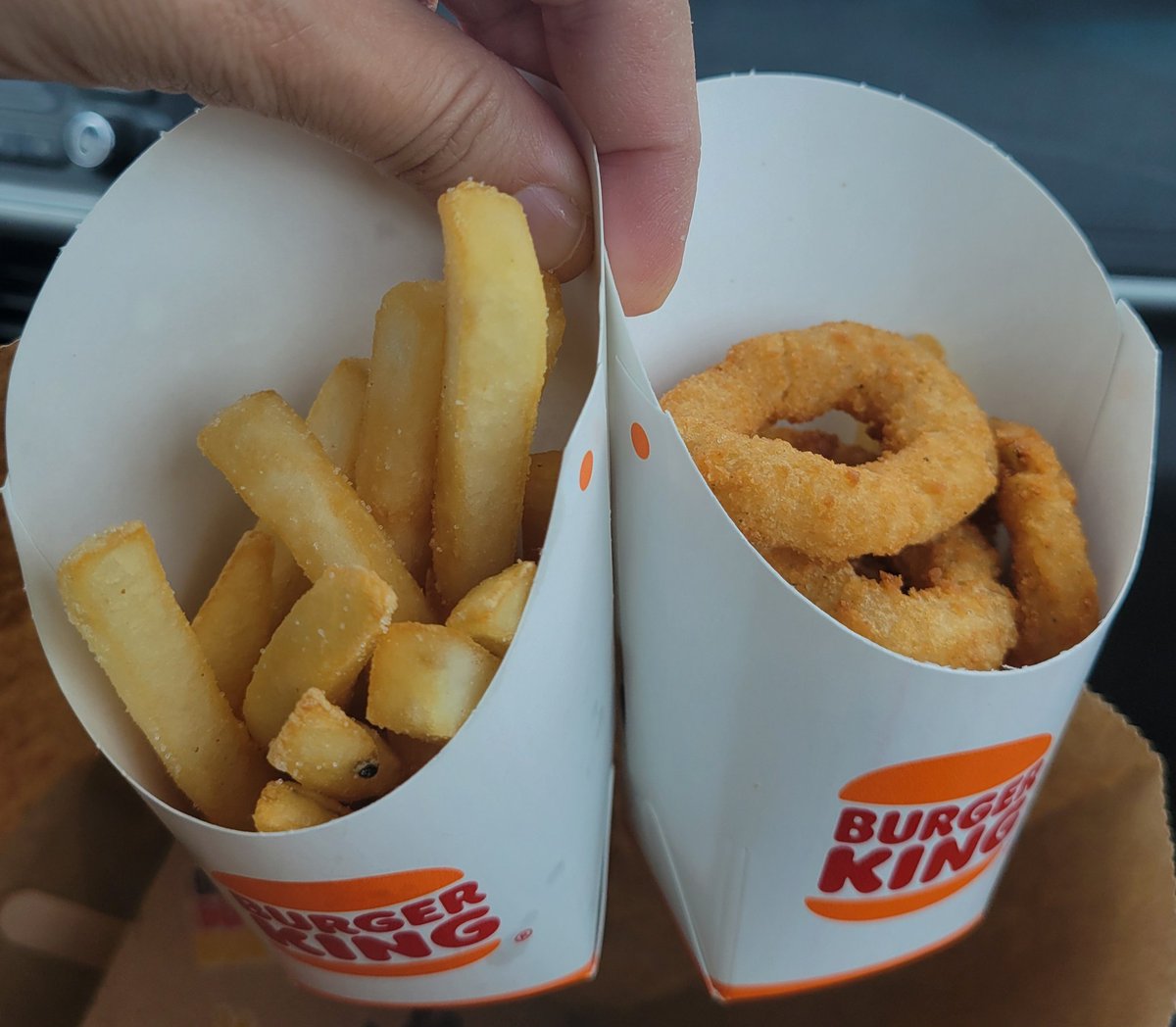 Koukla2014's tweet photo. @BurgerKing prices go up and portion sizes go down. We ordered two whopper combos; one with fries and one with onion rings. This is the portion size of the sides. Very disappointing. At least with McDonald's the prices go up but portions remain the same. https://t.co/MrehmbF9yF