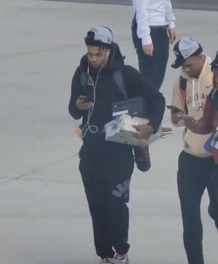 Estrada got off the plane with the original Apple headphones. Real hooper.