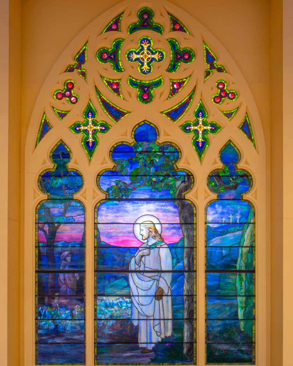 “Easter Morning,” designed by Louis Comfort Tiffany, features Jesus in a white robe standing among flowers and trees, his head illuminated by a halo. 🌅 #EasterSunday