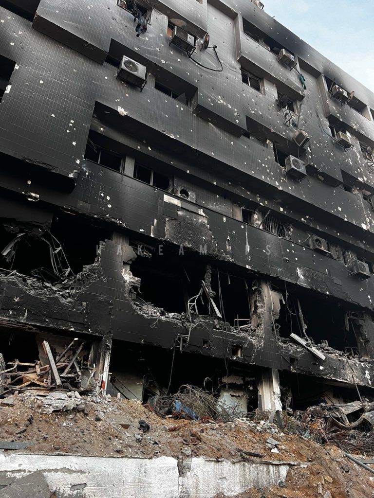 DrMadsGilbert's tweet photo. Today, we witness the total ISraeli destruction of the most important, 700 beds specialty hospital in Gaza, Al Shifa Medical Complex. It was established 78 years ago during the British Mandate, the name Shifa meaning 'The House of Healing'; now turned into a 'House of Death' by Israel and the US, burnt, totally destroyed to rubble and turned into a graveyard of patients, medical staff, relatives and refugees. A massive symbol of the heartless, cynical ISraeli politics of colonial occupation with the goal of elimination of the Palestinian people, their social institutions and their lives. US, EU, UK governments stand shamed, complicit by their support for ISraeli war crimes and atrocities against all humanity. Watch carefully the killing fields of Shifa, never ever forget the Gaza genocide, the perpetrators, and the complicit powers! Dr. Mads