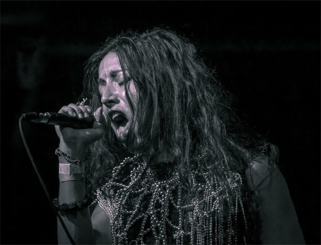 In the shroud of midnight, Annamaria Pinna's voice weaves through the shadows, a bewitching power that calls forth the whispers of the ancient, stirring souls with a melody that dances between realms. #vajra #vajratemple #gothicprog #femalefrontedmetal #femalemetalsinger