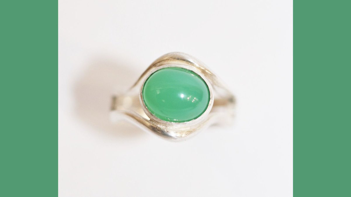 Michele's Silver Contour Ring features an oval Chrysoprase that is perfectly encased within the rounded shape on the façade of the ring. The simple bright green stone works well nicely with the fluidity and elegance of the silver band. #chrysoprase #silver #contemporaryring