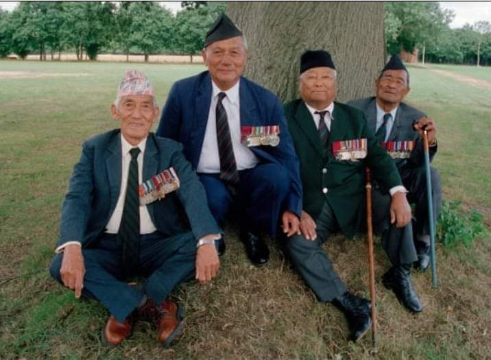 Bravest of the Brave, Four (Gorkha) Victoria Cross awardees sitting under a tree in London. Perhaps the most remarkable Gorkha *बहादुरी* photograph ever. L to R - Agansing Rai, 2/5 GR, Ganju Lama, 1/7 GR, Gaje Ghale, 2/5 GR and Bhanbhakta Gurung, 3/2 GR. Courtesy whatsapp.