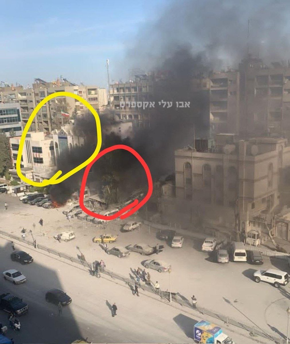 Suriye Şam göbeğinde operasyon. Resimde vurulan kırmızı bina, yanında sarı içinde  İran konsolosluğu. Suriye kaynaklarına göre 6 ölü.