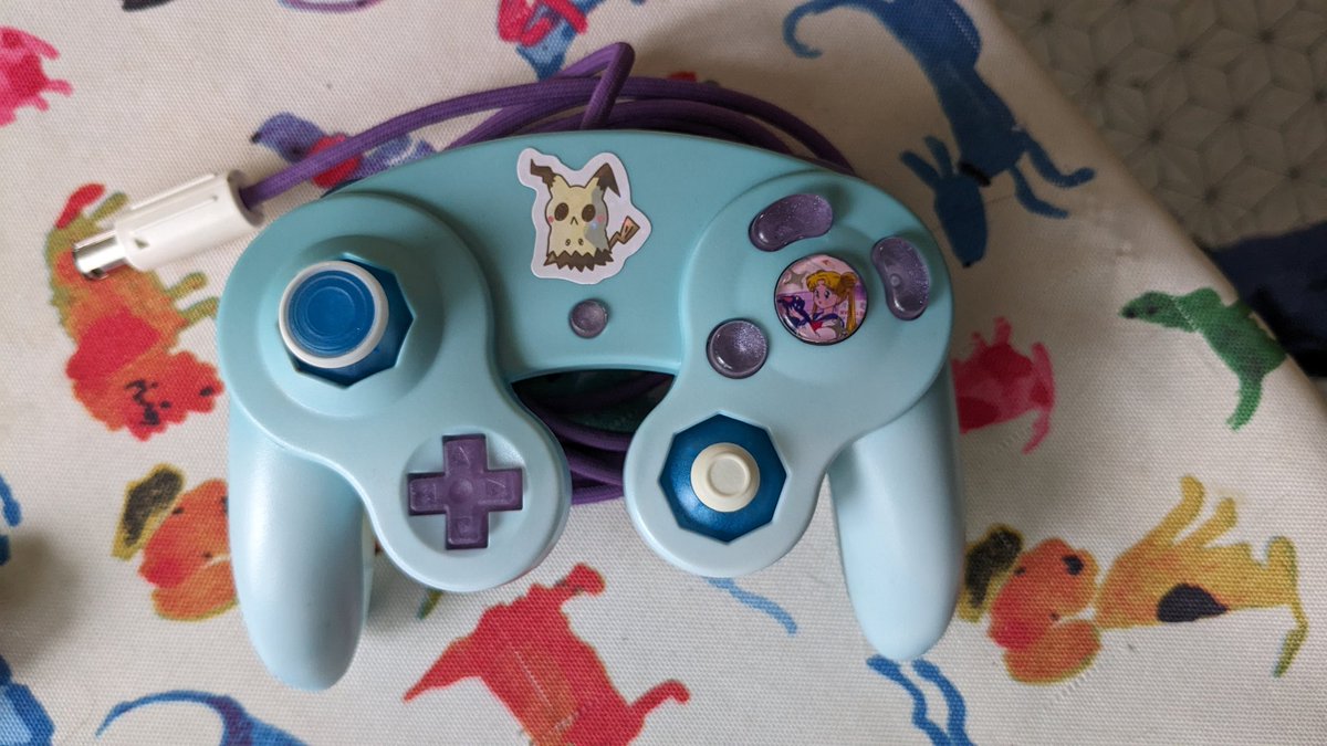Finally assembled my dream controller
Face buttons but <a href="/MauvesResinLab/">Mauve | Check Pinned 🧪✨</a> 
Phob and cord by <a href="/RogueportGCC/">RogueportCustoms</a>
Shoulder buttons by <a href="/thebuttonbender/">The Button Bender</a>
Sticks by @NorthGCC 
Shell by RJM55Customs on Etsy (couldn't find a twitter)
