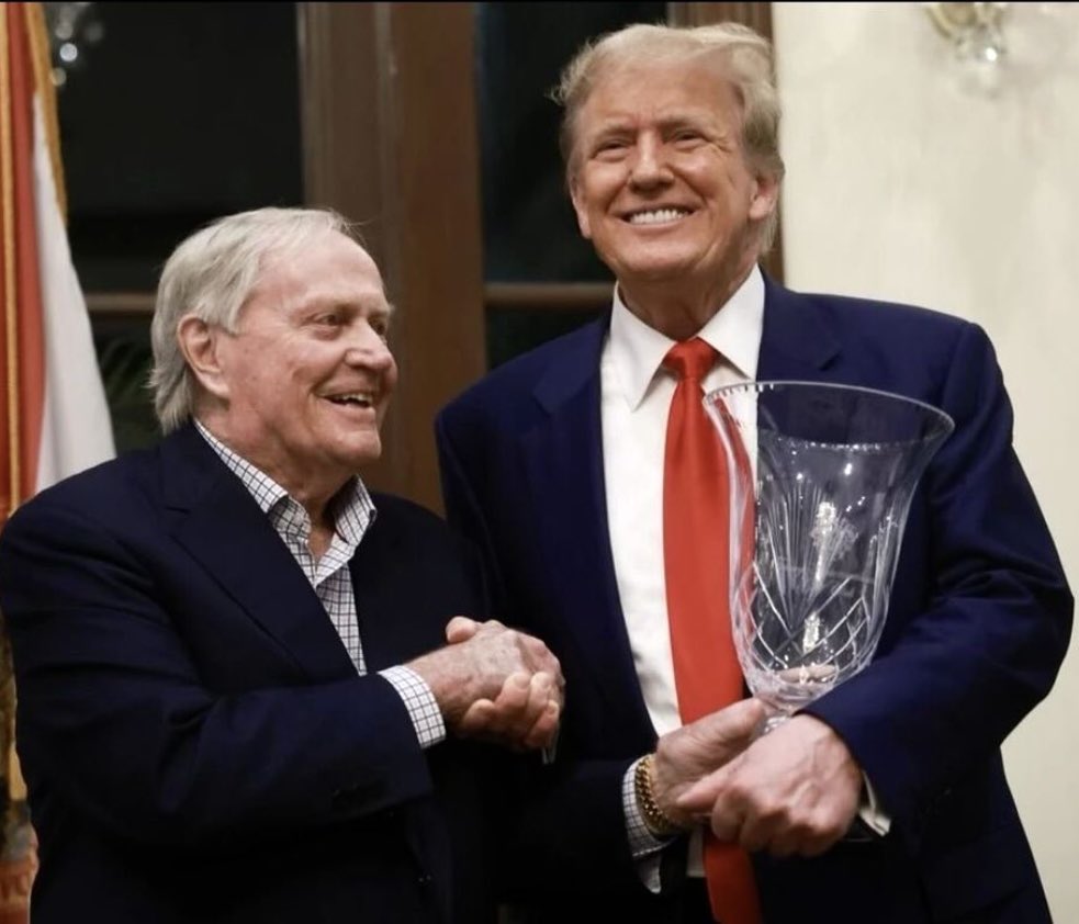 Jack Nicklaus giving Donald Trump some golfing trophy in Florida. The guy on the right is still mad about the ascendance of Barack Obama. The guy on the left is still mad about the ascendance of Tiger Woods.