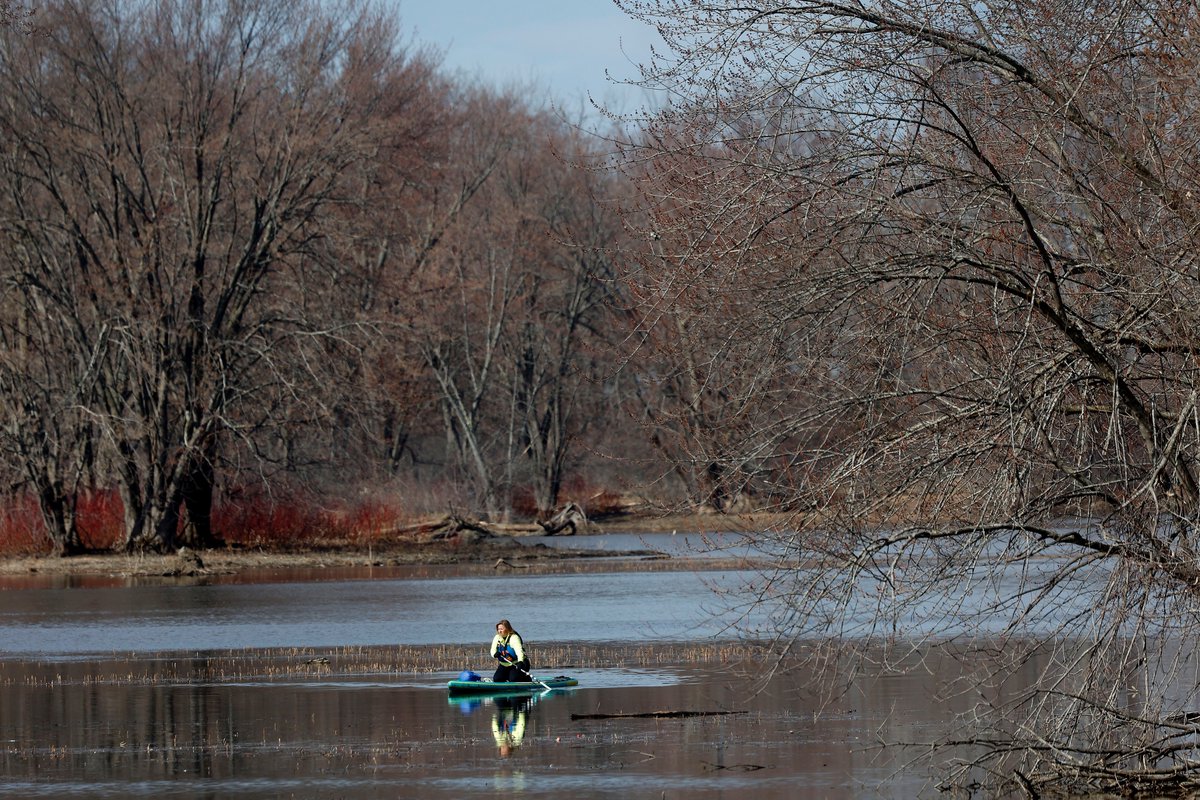 A woman takes advantage of a sunny day while #paddle boarding near Petrie Island Monday morning. #Ottawa #Spring
