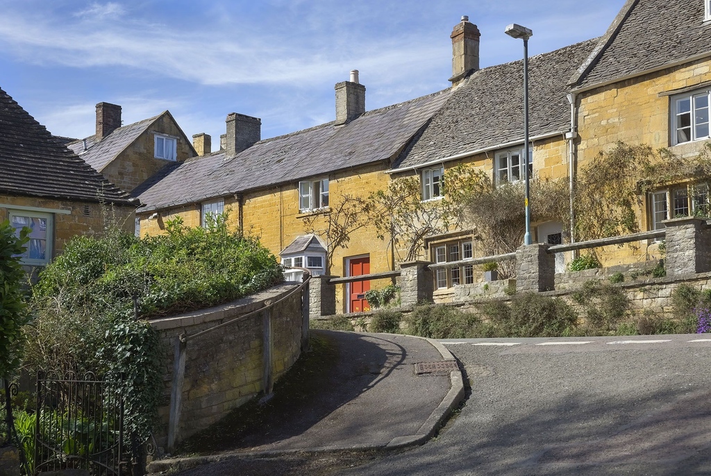 The Cotswolds, an area of outstanding natural beauty in England, is renowned for its villages, historic market towns, and limestone landscapes. The architecture here dates back to medieval times.