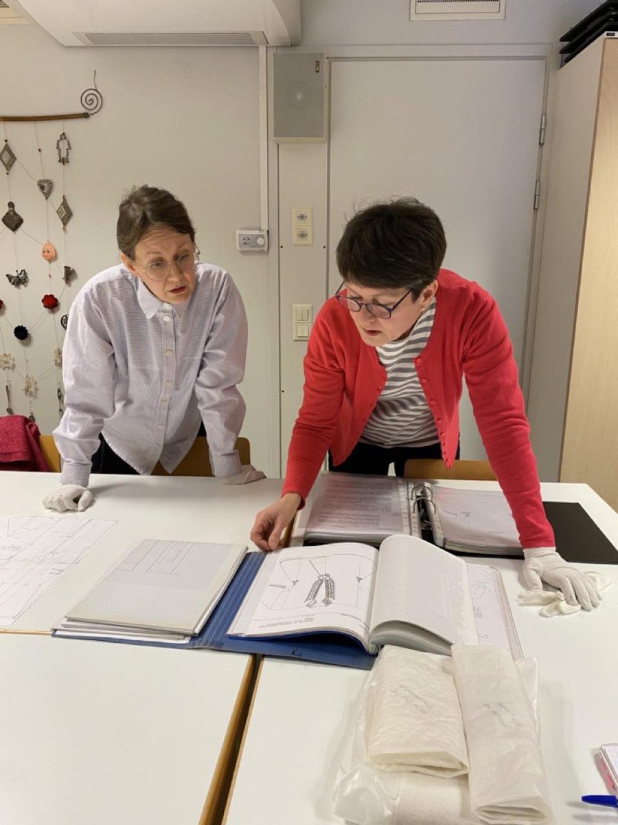 EU_TRACtion's tweet photo. Mari Kosunen and Aino Eerikäinen of the University of Helsinki visited the National Costume Center of Finland to study Eastern Finnish national costumes. Consultant Taina Kangas provided historical insights, noting similarities to 19th-century folk costumes, surprising the team. https://t.co/9SkVGq0qbh