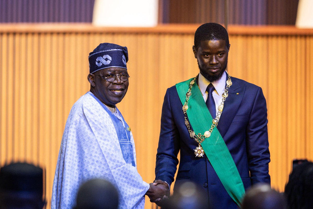 Bassirou Diomaye Faye and President of Nigeria, Bola Ahmed Tinubu, pose for photos after Faye’s swearing in as Senegal's president at an exhibition centre in the new town of Diamniadio near the capital Dakar on April 2, 2024. J📷 - OHN WESSELS / AFP