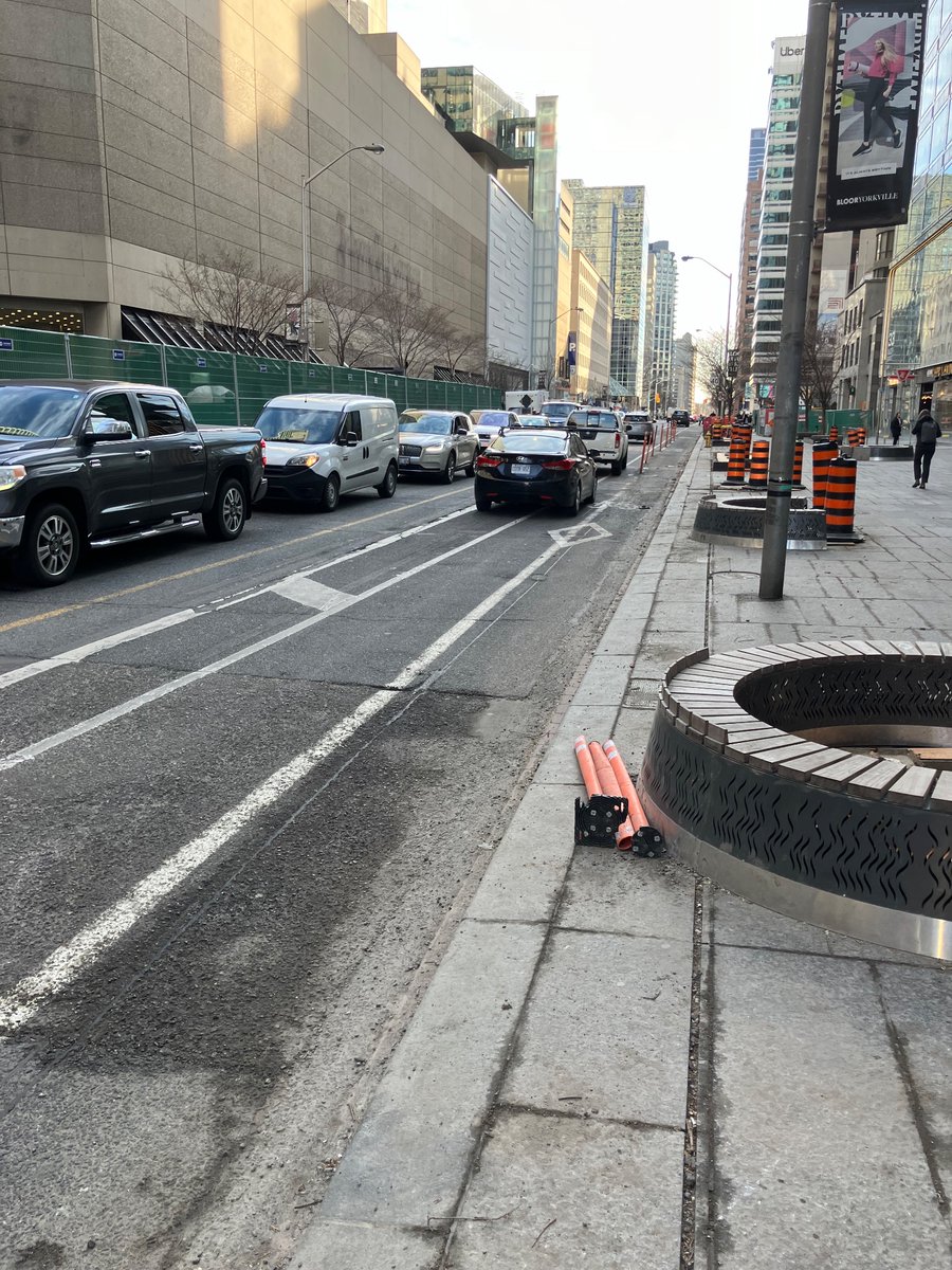 These flexi posts on Bloor at Yonge have been destroyed for a few weeks now. Can the city reinstall them? They provide needed separation during the construction.