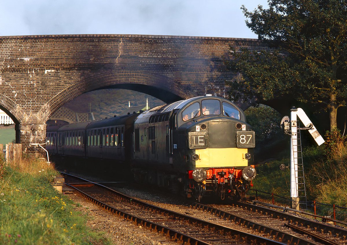 D6732 (37032) 'Mirage', heads into the setting sun at Weybourne on 26 September 1998 with the 16:50 Sheringham to Holt service, passing one of the North Norfolk Railway's distinctive somersault signals. 
Photo by Martin Loader
hondawanderer.com