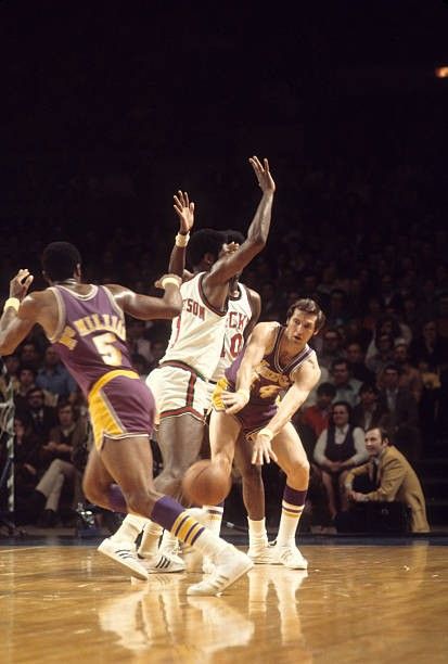 Jerry West passing to Jim McMillian.