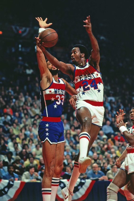 Moses Malone and Kareem Abdul-Jabbar in the All-Star Game.