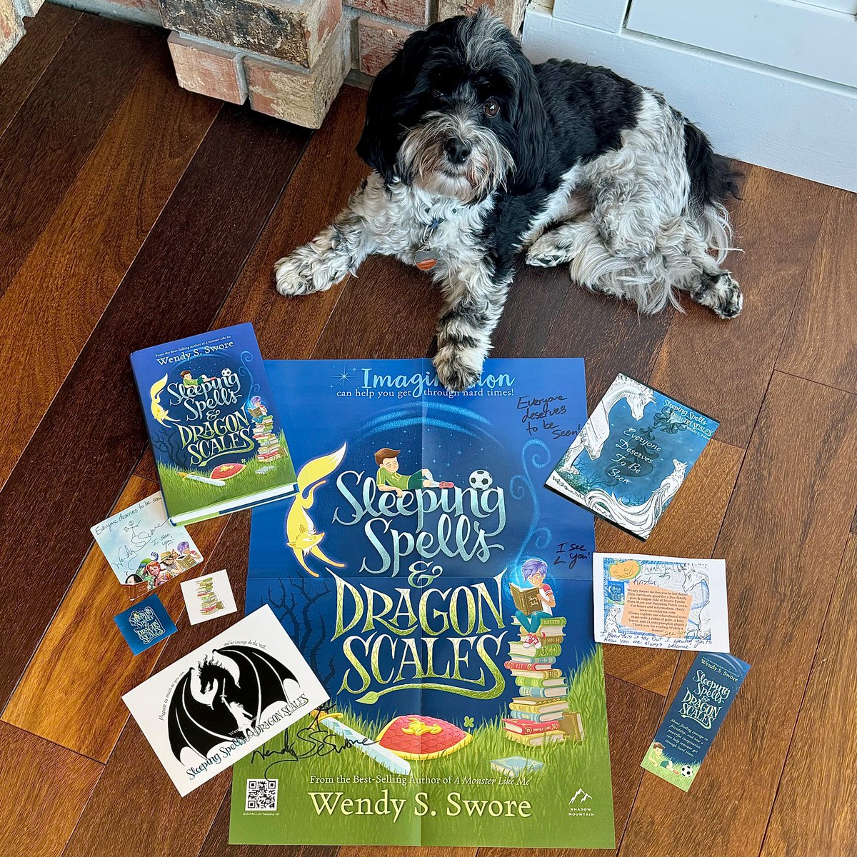 Happy book birthday to @WendySwore’s newest novel, Sleeping Spells and Dragon Scales! 💙📚🐉⚽️💙 Get your copy today! Swipe to see Watson inserting himself into my book and swag photo shoot. 😂