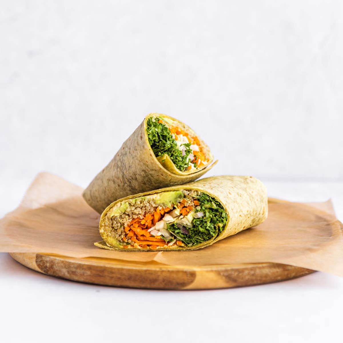 Vegan Wrap 🌯
Kale, quinoa, cabbage, carrots, pickled red onions, avocado, and hummus, wrapped in a spinach tortilla and served with tahini. 

#VeganWrap #Vegan #VeganOptions #PlantBased #KaleMeCrazy #HomewoodAL